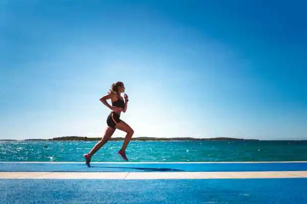 Woman running showing strong leg muscle Bloxwich